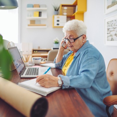 Senior woman sitting at a desk