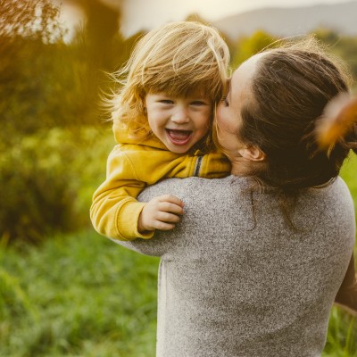 Woman holding young child